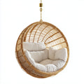 Fauteuil suspendu rond en rotin avec coussins blancs