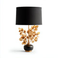 Lampe de table avec socle noir et décorations florales dorées, abat-jour noir