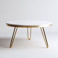 Table basse ronde en marbre blanc et acier doré